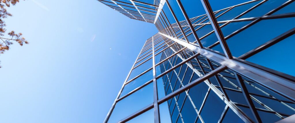 Modern glass commercial building representing real estate growth and professionalism