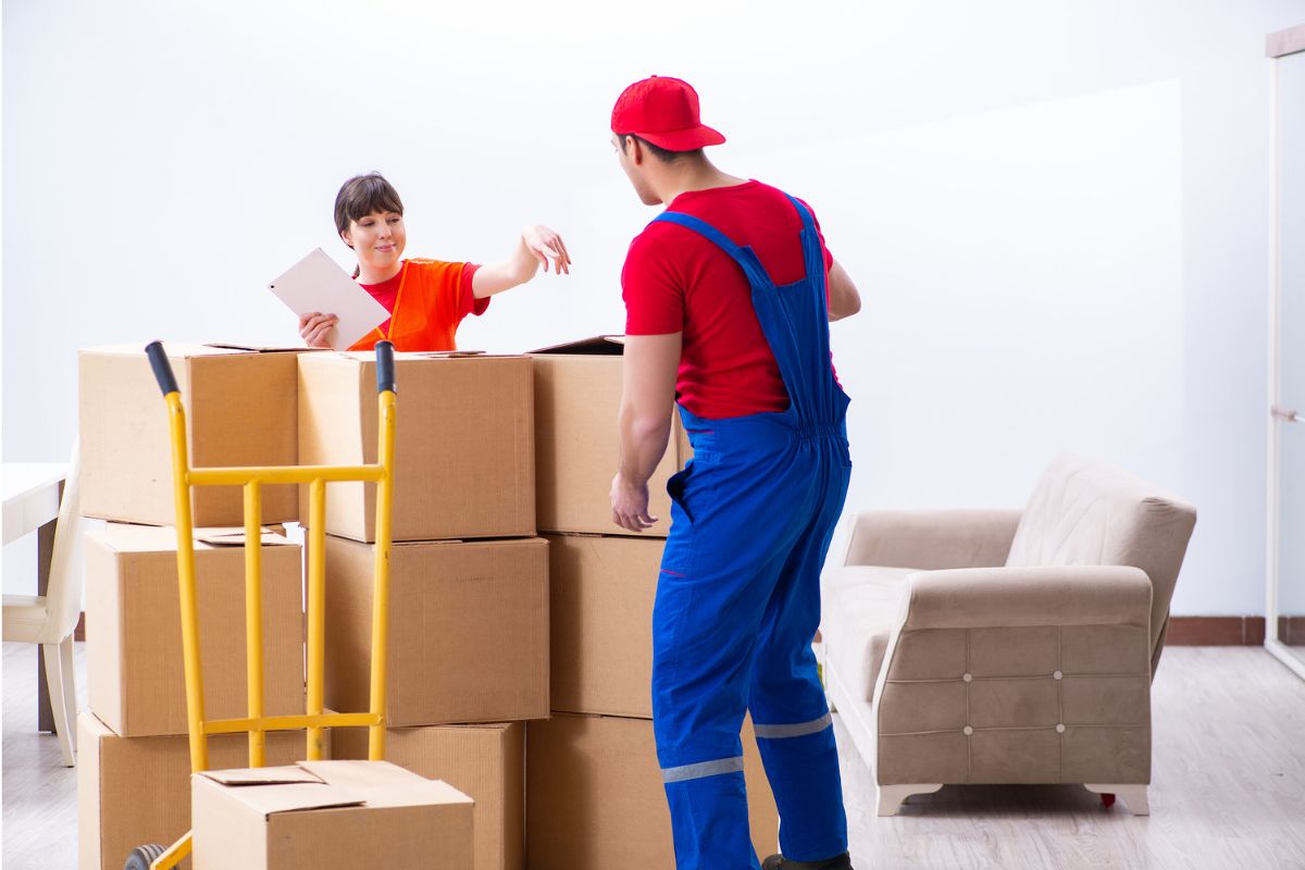 Moving company staff packing boxes for a home relocation